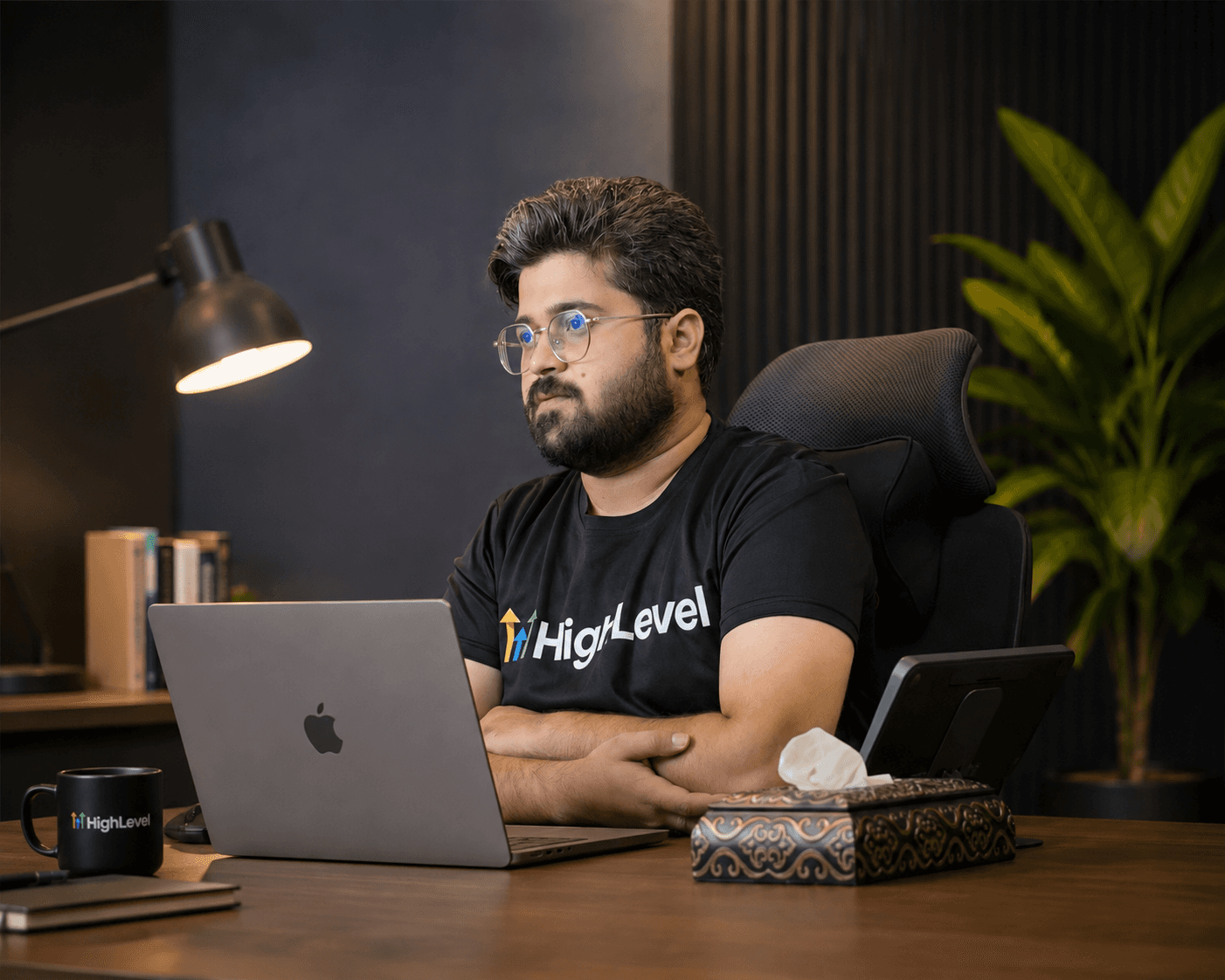 Hammad Raza reviewing CRM and automation systems at his desk